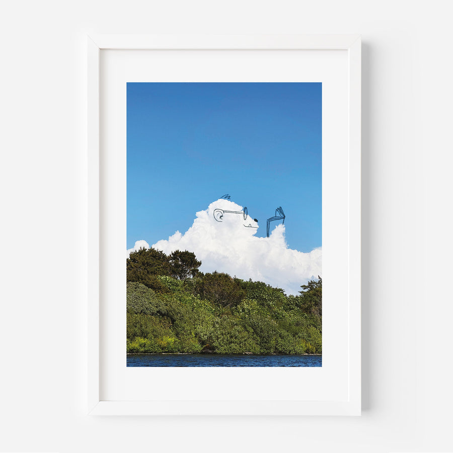 Photograph of a scenic landscape with trees and blue sky.